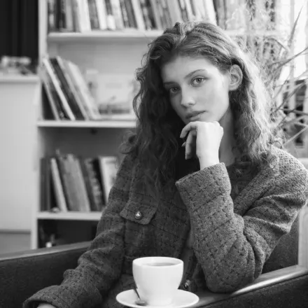 Vera is in a coffee shop