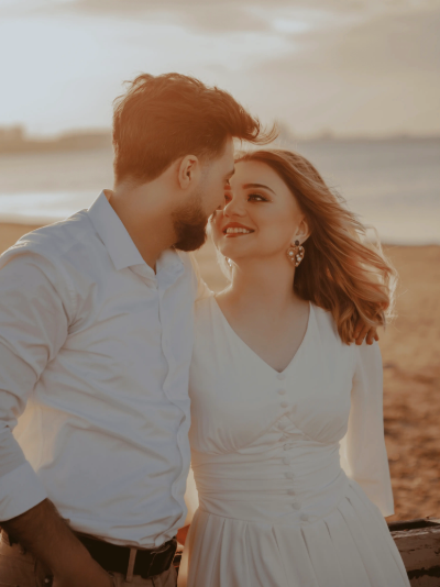 A man and a woman looking and smiling at each other