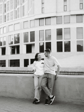 A man and a woman looking and smiling at each other